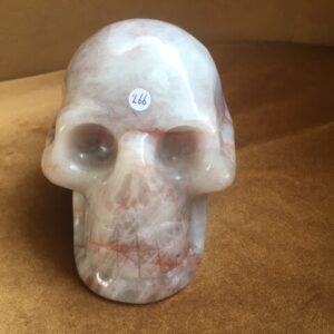 Golden LeMUrian Healer Skull XL 1 - Bergkristal met Hematiet insluitsels